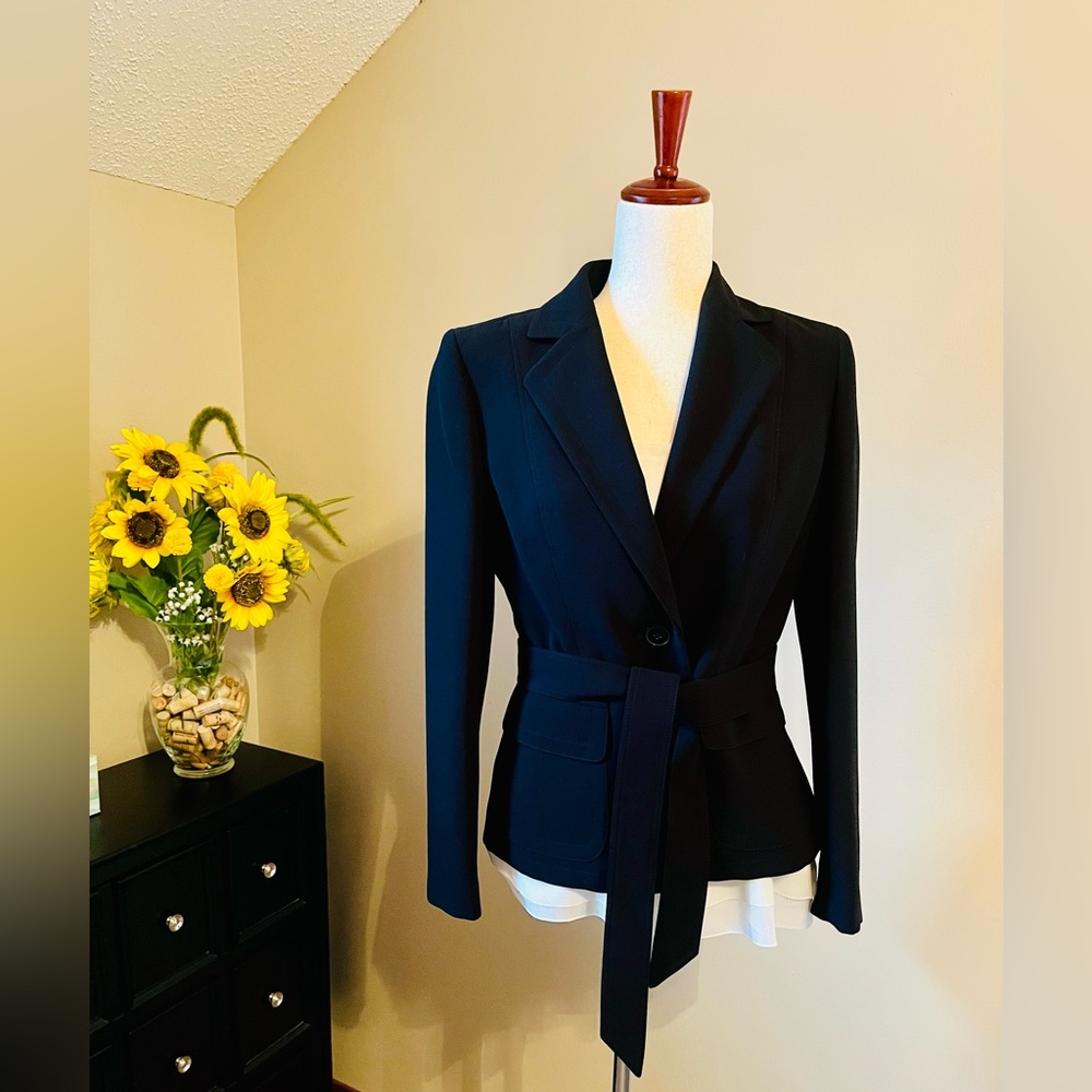 Black, one-button, lined and self belted blazer in a high quality polyester